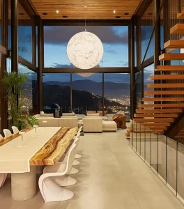 a room with a large window and a table and chairs
