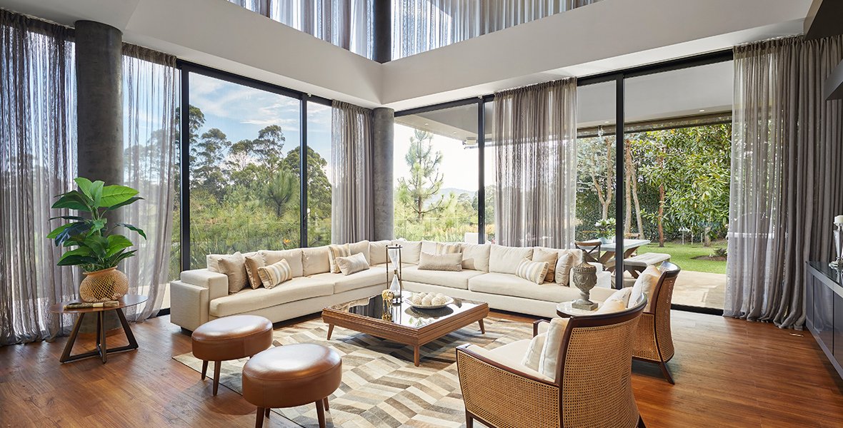 a living room with a large couch and chairs