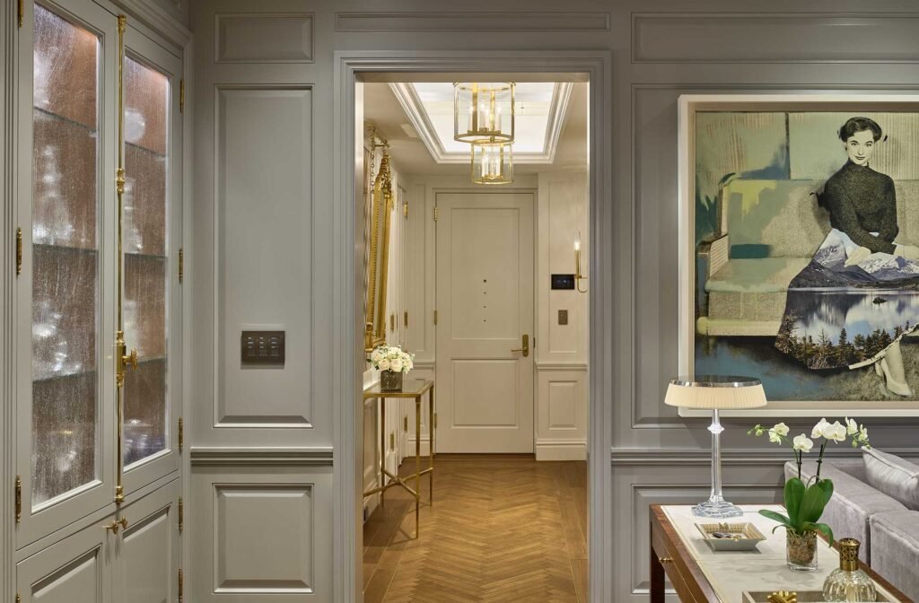 a hallway with a door and a table